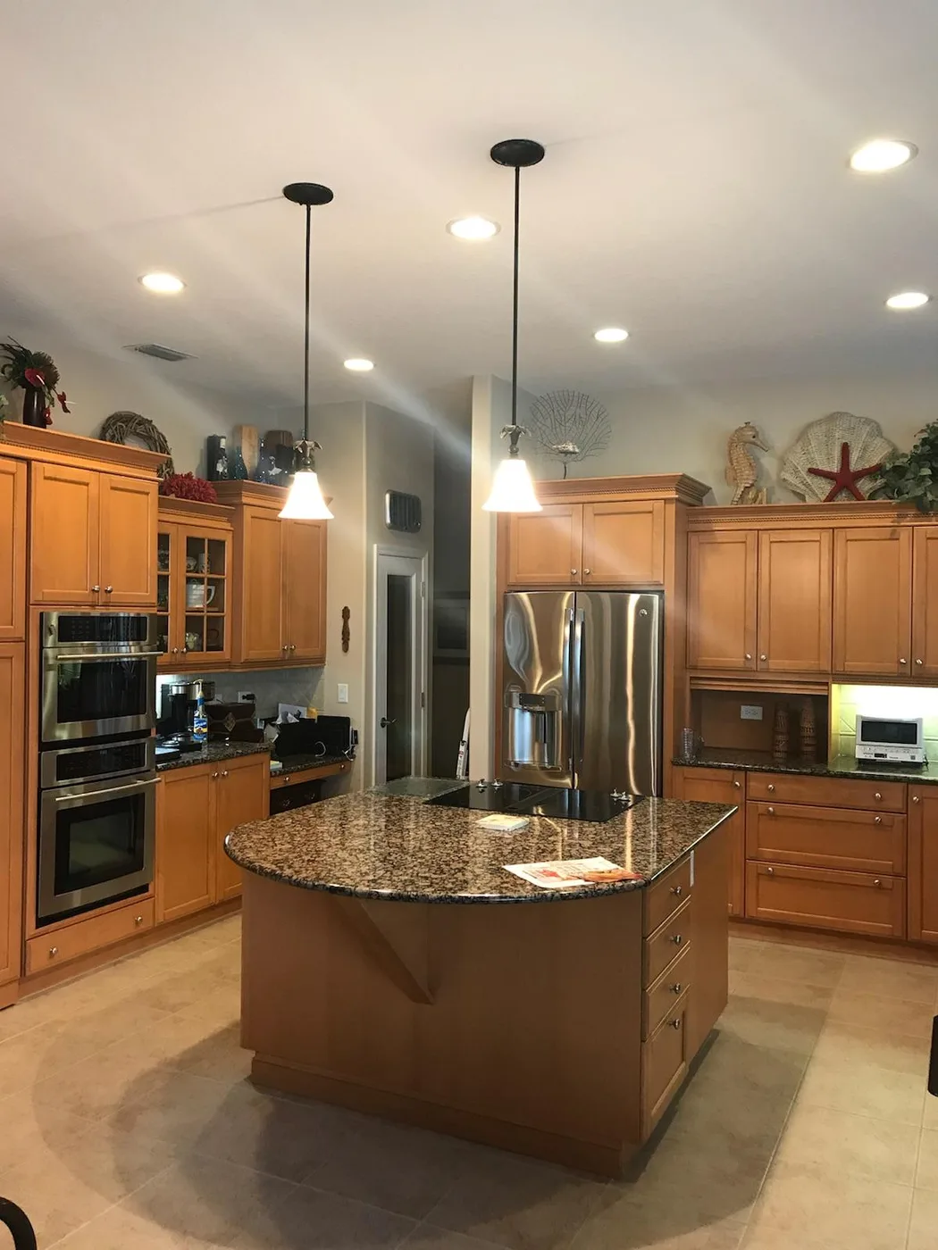 Tampa Bay kitchen before refacing, with dated honey-oak cabinets