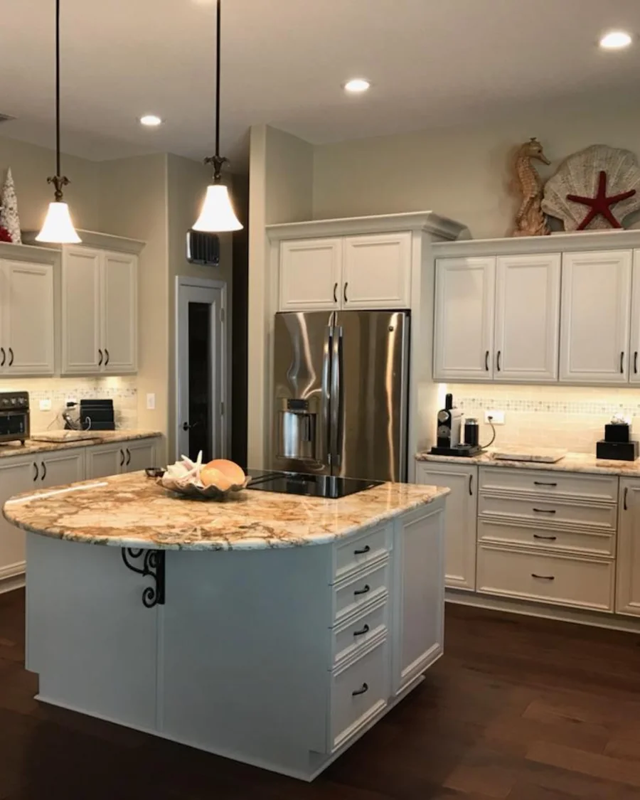 Bright white refaced kitchen cabinetry by Quality Cabinet